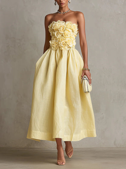 Vestido midi amarillo sin tirantes con flor 3D