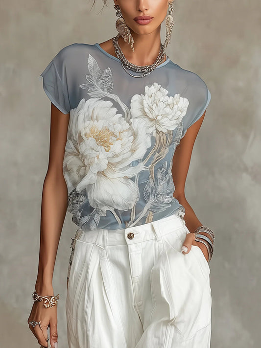 Blusa azul de gasa con estampado floral