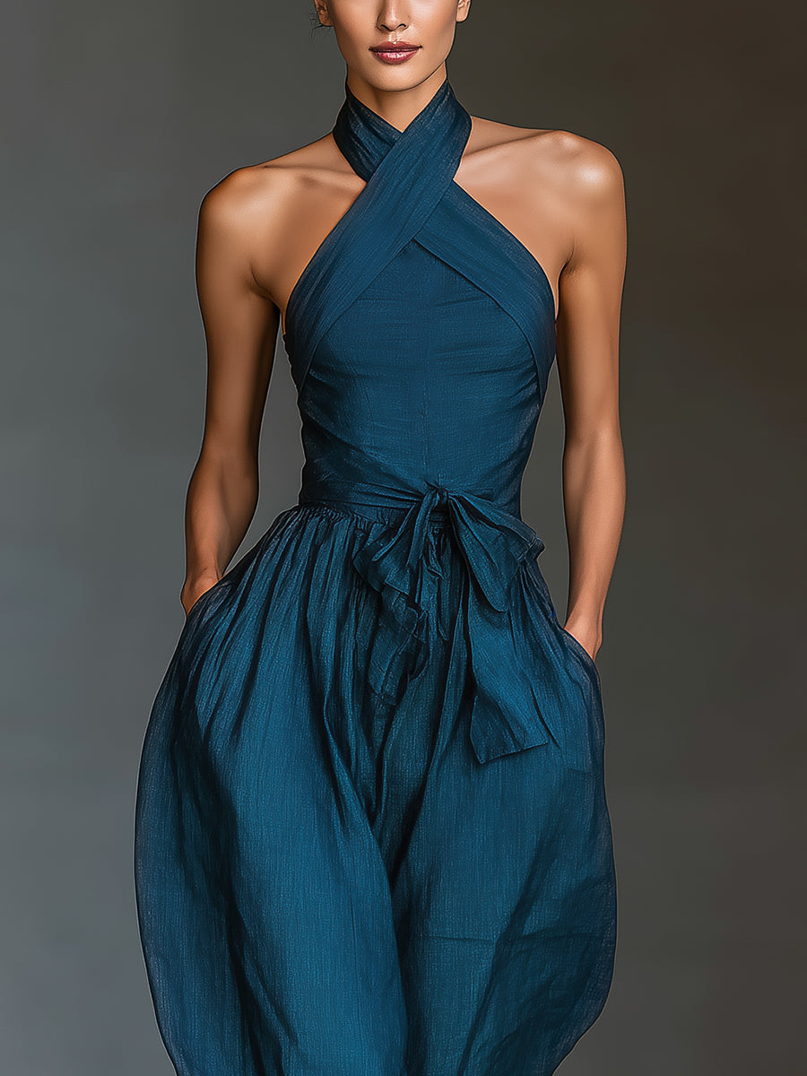 Mono de lino azul marino con espalda cruzada y pantalones anchos