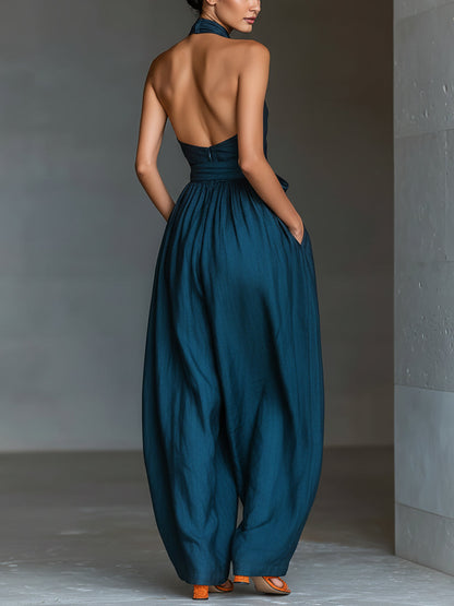 Mono de lino azul marino con espalda cruzada y pantalones anchos