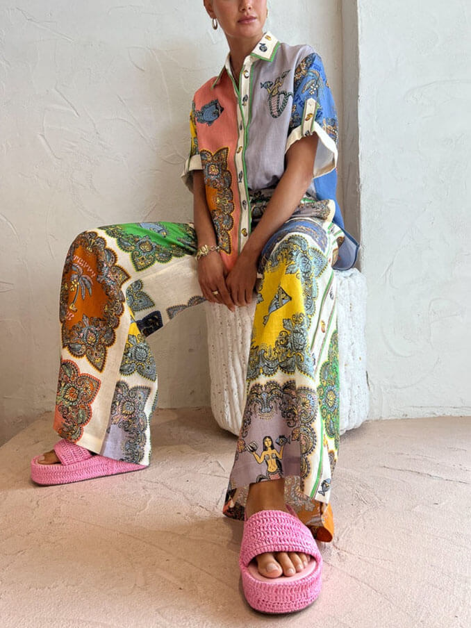 Pantalones anchos con estampado floral y satén paisley
