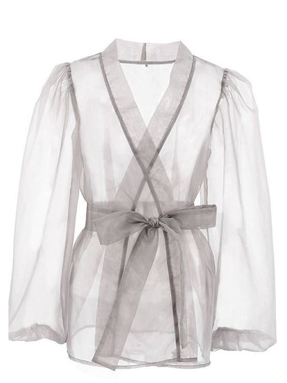 Blusa elegante transparente con cuello en V y mangas largas abullonadas con pajarita