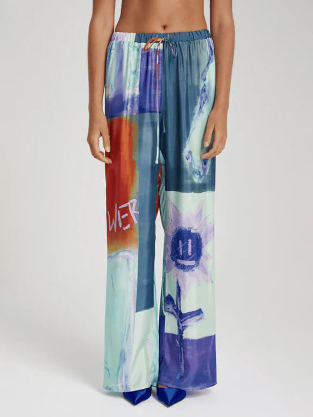 Pantalones anchos holgados con estampado floral de Unique Ink