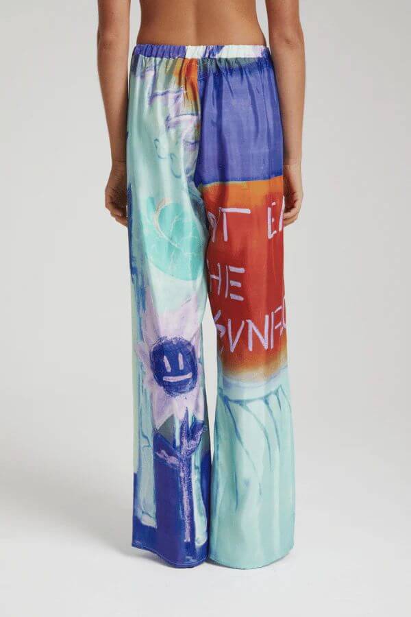 Pantalones anchos holgados con estampado floral de Unique Ink