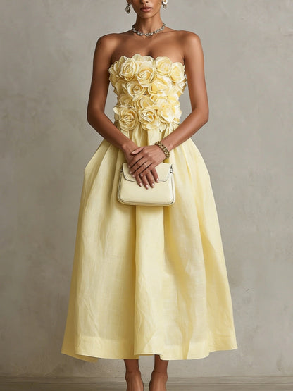 Vestido midi amarillo sin tirantes con flor 3D