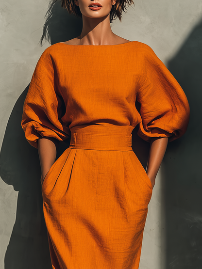 Conjunto de blusa naranja de manga media y falda midi