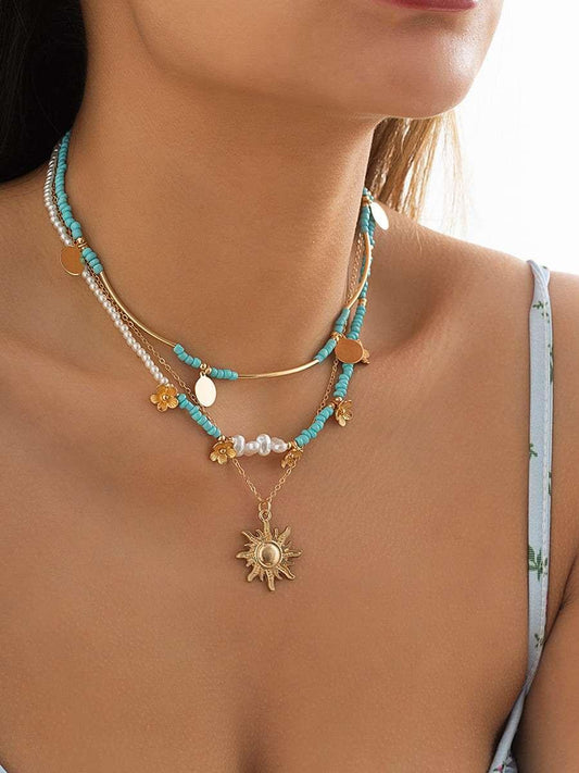 Collar de 3 piezas con perlas falsas, cuentas florales y sol